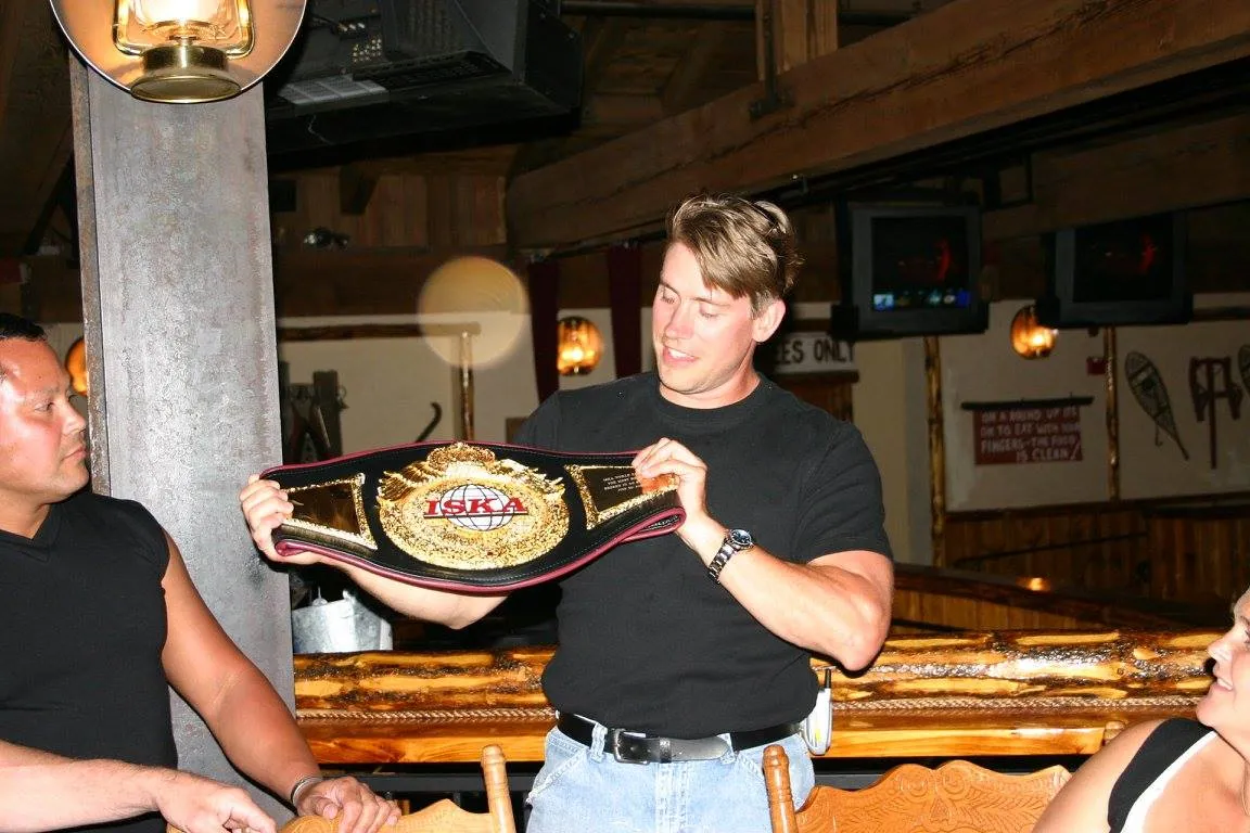 Leif Becker holding a championship belt